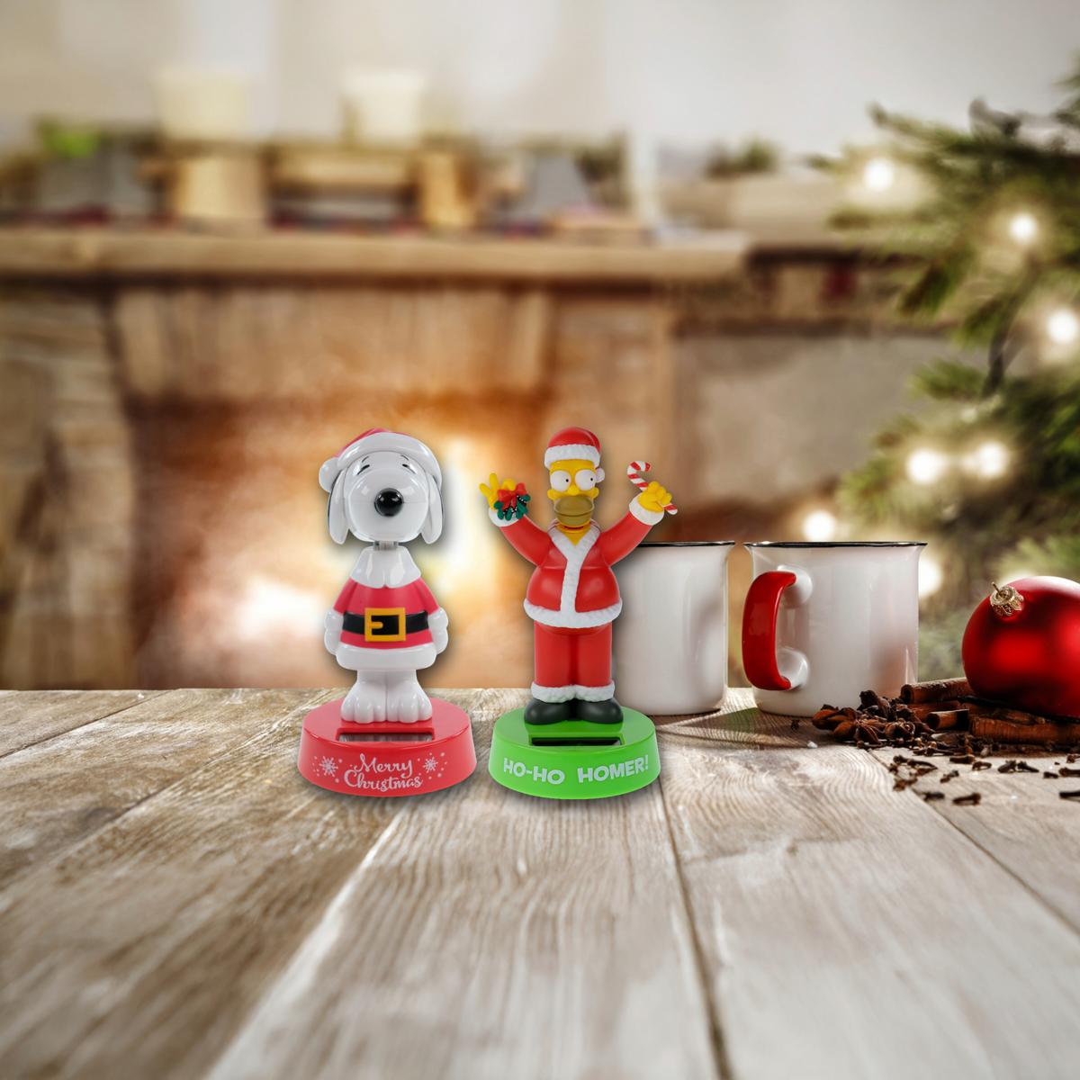 Examples of holiday solar bobbleheads: a Snoopy in a Santa suit and Home Simpson in a Santa suit