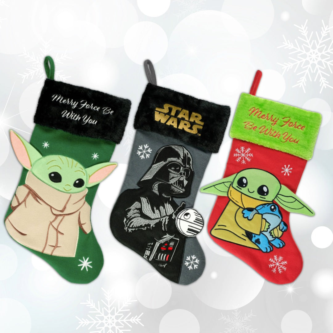 Examples of Star Wars holiday decor: two Grogu Christmas stockings and a Darth Vader Christmas stocking