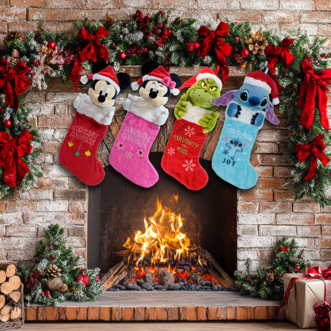 Examples of WondaPop's Christmas stockings hanging above a fire: the Mickey Mouse plush head stocking, Minnie Mouse plush head stocking, Grinch plush head stocking, and Stitch plush head stocking