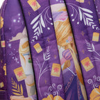 Close-up of WondaPop Disney Rapunzel - Tangled 16" School Backpack's straps printed with a whimsical illustration featuring yellow flowers, white leaf motifs, small yellow lanterns, and star details.
