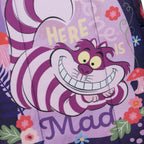 A close-up of a WondaPop Disney Cheshire Cat - Alice in Wonderland 16" School Backpack back fabric surface featuring a Cheshire Cat design with the words 'HERE IS Mad' and floral accents in a whimsical Mad Tea Party style.