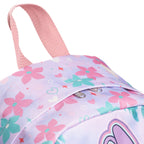 Close-up of a light purple backpack with a pink floral print, featuring pink fabric handles and a silver zipper pull.