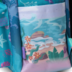 Close-up of WondaPop Disney Ariel - The Little Mermaid 16" School Backpack showing a left side pocket with an underwater scene print in turquoise, pink, green, and orange, alongside a teal side pocket with starfish and shell motifs.