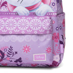 Close-up of a Disney backpack in lavender and purple with a floral print, a front pocket, and a visible Disney logo patch. Part of Marie is visible at the top.