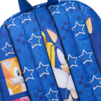 Close-up of a blue backpack straps featuring Sonic the Hedgehog graphics, including stars and geometric patterns. Character graphics can be seen peeking through the straps. 