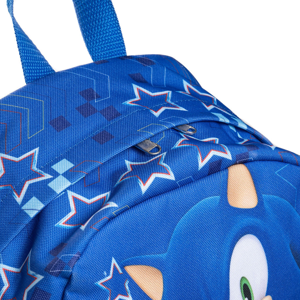 Close-up of the top of a blue backpack featuring Sonic the Hedgehog graphics, including star patterns.