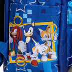 Close-up of WondaPop SEGA Sonic the Hedgehog 16" School Backpack' right side pocket featuring Sonic the Hedgehog characters including Sonic, Knuckles, and Tails with gold rings on a patterned blue background.