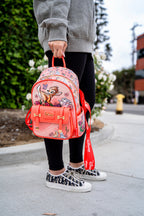  Close-up of Disney Loungefly Bambi mini backpack being held by hand, styled with casual streetwear